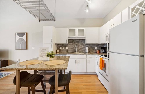 Mill District Apartment | Inviting CozySuites Mill District with Pool and Gym Access