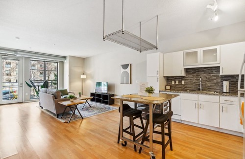 Mill District Apartment | Inviting CozySuites Mill District with Pool and Gym Access