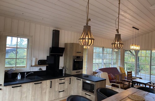 Saint-Julien-en-Born Villa | Experience Tranquility at La Cabane sur le Courant Hotel