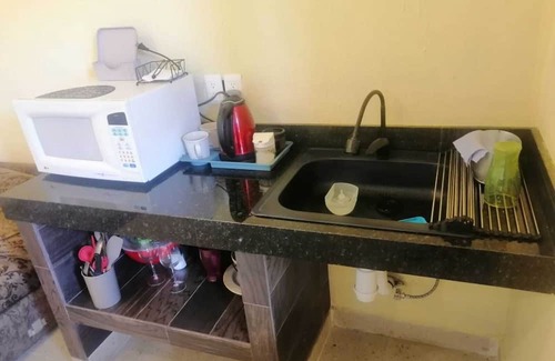 El Zacatal Apartment | Convenient Stay Near Airport and Beaches with Parking