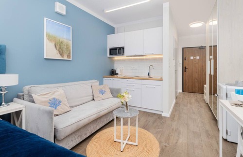Przymorze Apartment | Bright Blue Studio in Gdańsk with Desk & Gym Access
