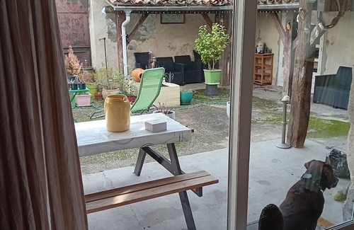 Mezin House | Charming Ancienne Chapelle: Cozy Rooms & Outdoor Terrace