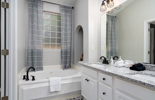 Alabaster House | Relax in a Gardenside Retreat with Fenced Yard & Patio