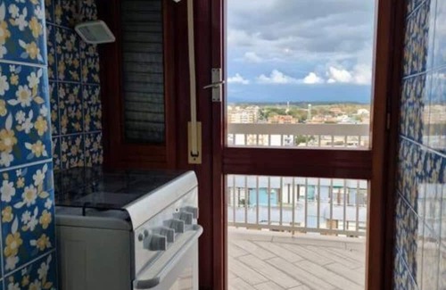 Nettuno Apartment | Family-Friendly Stay at Mare Fuori with Kitchen Amenities