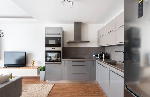 Karlin Apartment | Osko Apartments: Family-Friendly Retreat with Spa and Kitchen