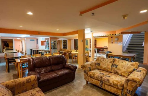 Mauricie House | Family Room with Pet-Friendly Amenities for Memorable Stays