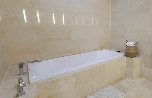 Bahamia West Condo | Gated Lux family size condo near beach w/boat dock, working station, pool, canal