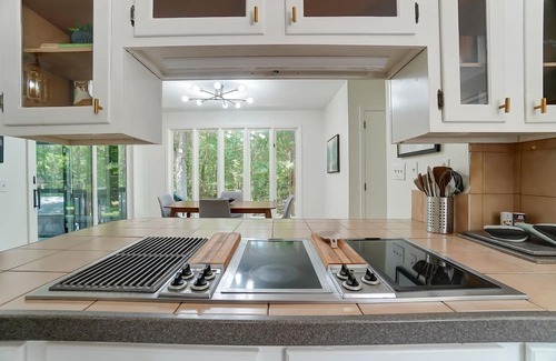 Charlotte House | Unwind at The Escape: Heated Pool & Pet-Friendly Bliss