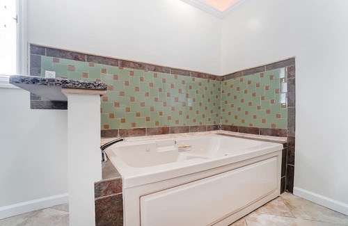 Charlotte House | Unwind at The Escape: Heated Pool & Pet-Friendly Bliss