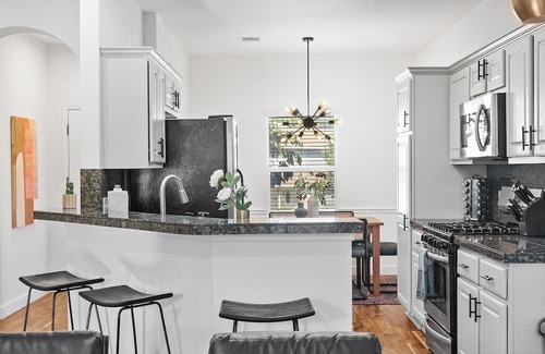 University Hills and Windsor Park House | Inviting East Side Digs with Heated Cowboy Pool