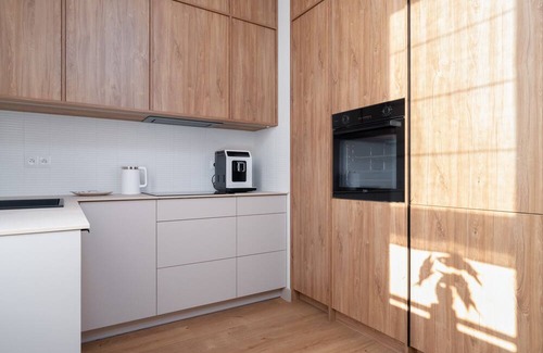 Poznan Apartment | Modern Beige Apartment in Poznań with Family Amenities