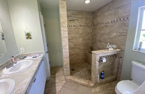 Joel Villa | Tranquil 3-Bedroom Home with Heated Pool & Ocean View