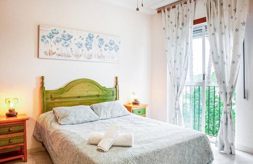 El Portil Apartment | Enjoy a relaxing vacation in this inviting vacation home with a community pool.