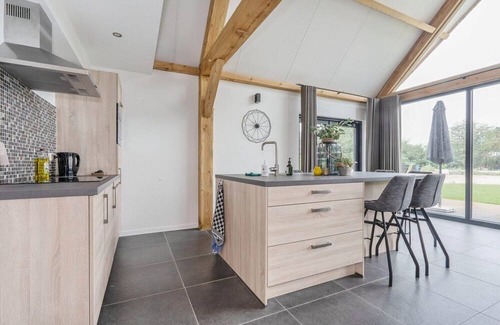 Baarle-Nassau House | Modern lodge stay with pond view