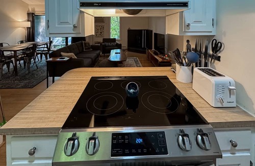 Quechee Condo | Cozy condo w/balcony, river view, electric woodstove, w/d, wifi, kitchen, a/c