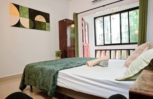 Benaulim Bed & Breakfast | Styled midcentury apartment with huge terrace. 5 minute walk to the beach!