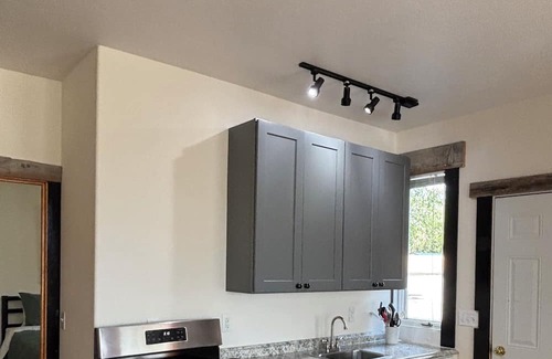 Pinedale Apartment | Large windows bring the outside in.