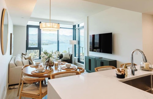 South Pandosy Condo | Enjoy lakefront living at its finest in this stylish condo! Relax by the pool, soak in the stunning water views, and unwind in comfort—just steps from the shoreline.