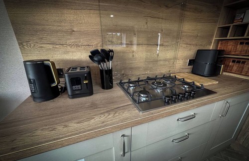 Longridge Cabin | Hobbit - House Of The Owl. Luxury lodge with views. Pet friendly. Indoor Pool.