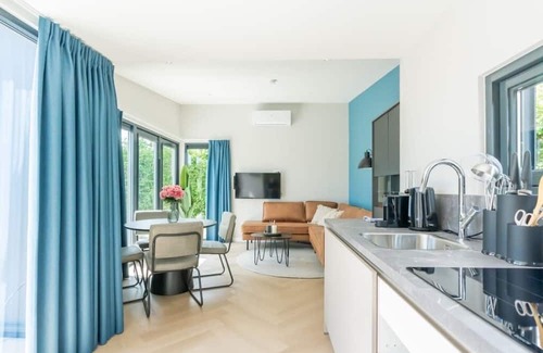 Scharendijke House | Welcome to Muralt 111, a modern chalet with everything for a carefree stay. Enjoy the cozy living ro