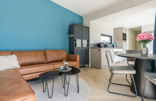 Scharendijke House | Welcome to Muralt 111, a modern chalet with everything for a carefree stay. Enjoy the cozy living ro