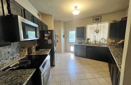 Rowlett House | Quiet guest room with WiFi, weightroom, and outdoor area.
