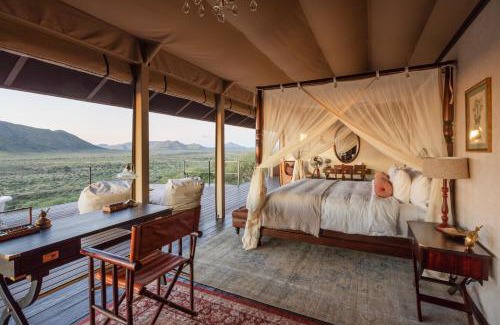 Windhoek Cabin | Gmundner Lodge: Oceanfront Escape with Spa & Pool Amenities
