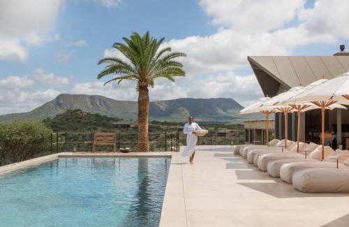 Windhoek Cabin | Gmundner Lodge: Oceanfront Escape with Spa & Pool Amenities