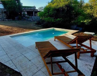 Falda del Carmen Villa | Discover Casa de Piedra: Family-Friendly with Pool & Hot Tub