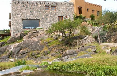 Falda del Carmen Villa | Discover Casa de Piedra: Family-Friendly with Pool & Hot Tub