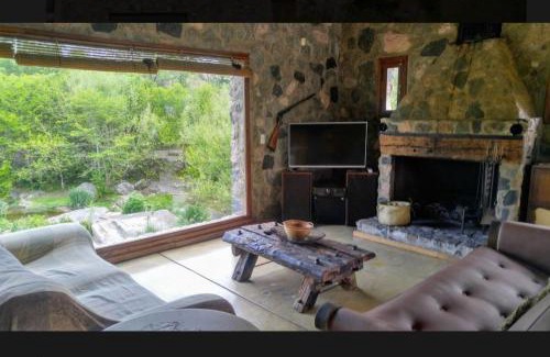 Falda del Carmen Villa | Discover Casa de Piedra: Family-Friendly with Pool & Hot Tub