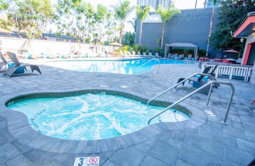 Civic Core Apartment | Downtown Oasis with Pool and Jacuzzi - 4-Star Retreat