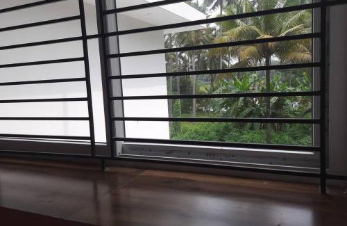 Irinjalakuda Apartment | Waterfront Homestay in Thrissur: Family-Friendly Retreat