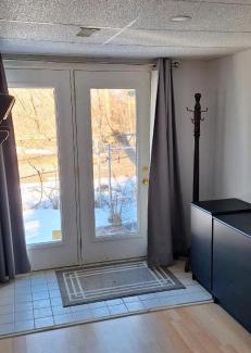 Ottawa Division House | Serene Nature Retreat with Inviting Hot Tub Experience