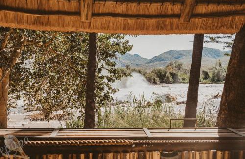 Epupa Cabin | Explore Epupa Falls Lodge with Pool & Pet-Friendly Amenities