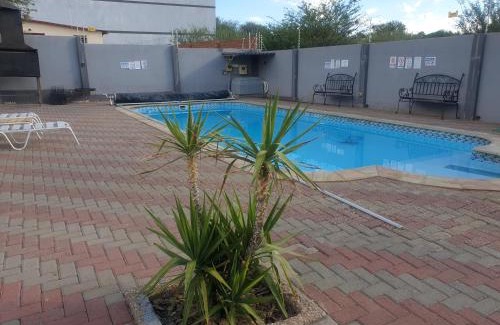 Windhoek West House | Cozy World Sossego Guest House with Pool & Restaurant