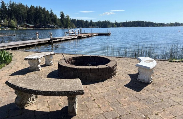 Lakefront property, beautiful view with steps into water, large private dock.