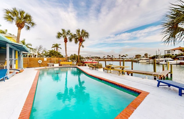 Renovated, waterfront townhome with pool & dock - walk to the beach