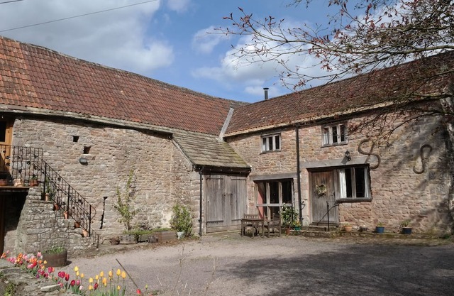 Converted stables and hayloft in former historic farmyard