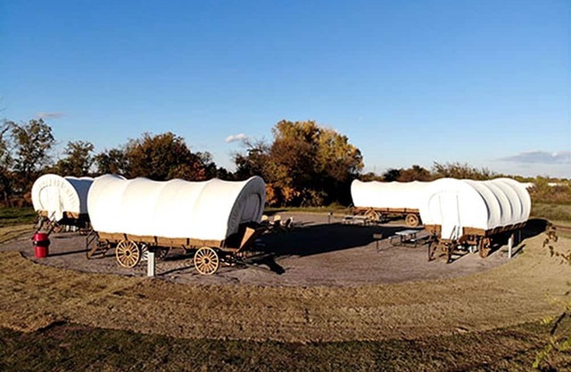 Perfect Glamping Vacations in this Rustic Conestoga Covered Wagon Rental in Oklahoma
