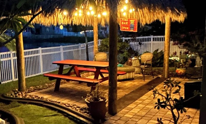 Miramar House | Beautiful lakefront retreat with outdoor kitchen, tiki hut and spa.