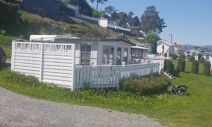 Sande Cottage | Explore Fjordcamping Holmsryggen: Pet-Friendly Retreat