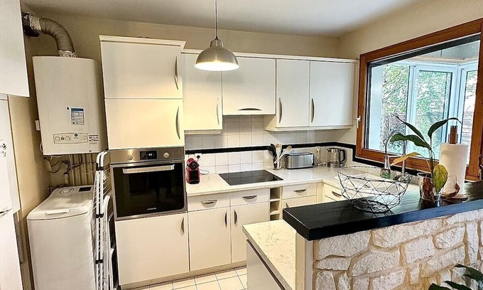 Les Aunettes Apartment | Charming Apartment with Garden Near Paris & Family Amenities