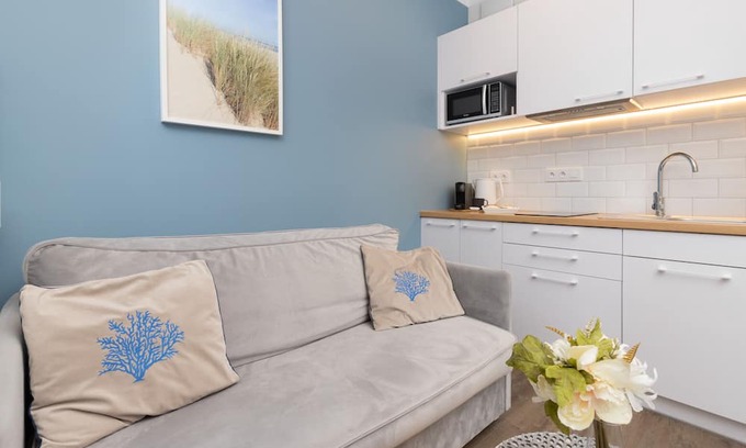Przymorze Apartment | Bright Blue Studio in Gdańsk with Desk & Gym Access