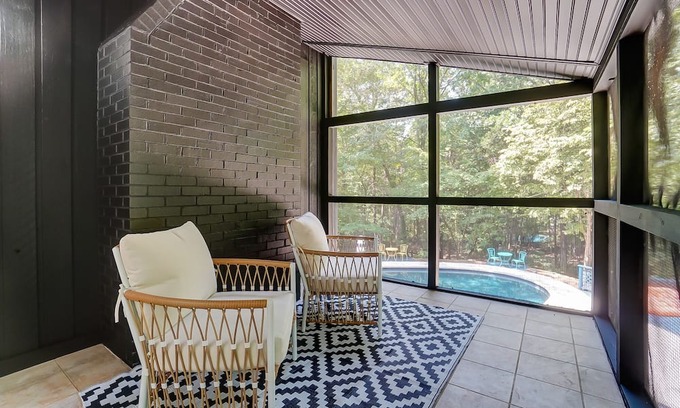 Charlotte House | Unwind at The Escape: Heated Pool & Pet-Friendly Bliss