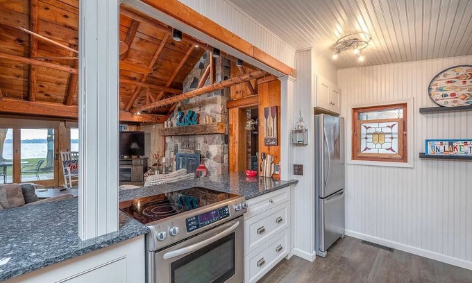 Cadillac Cottage | Charming Lakefront Cottage with Ocean Views & Modern Amenities