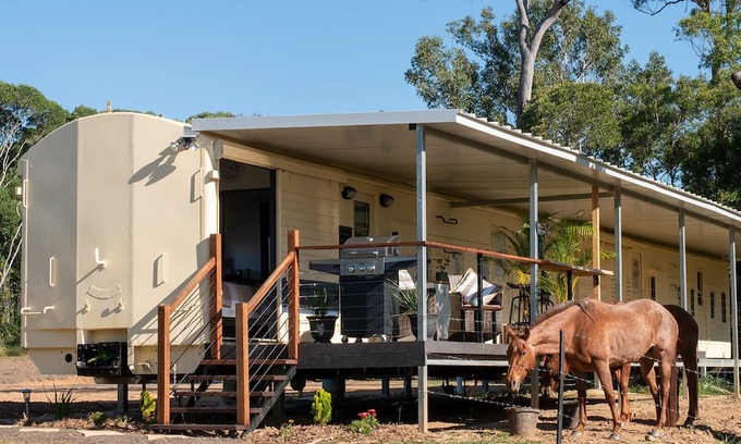 Barrine Cottage | Train Carriage in peaceful surrounds with mountain views on a farm.