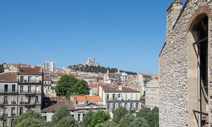 La Castellane Apartment | Central Marseille Apartment with Cozy Fireplace Amenities