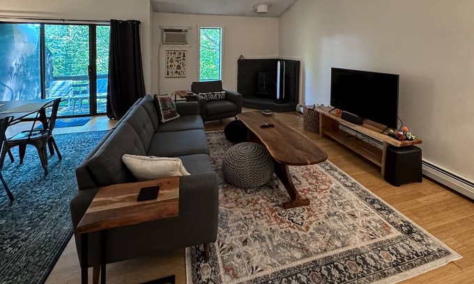 Quechee Condo | Cozy condo w/balcony, river view, electric woodstove, w/d, wifi, kitchen, a/c