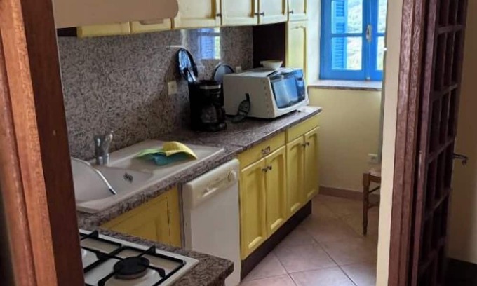 Zicavo House | Village center house with terrace.